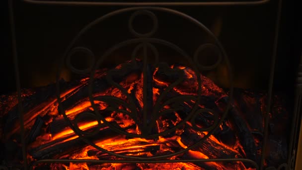 Flames of electronic fireplace. Close up. tongues of fire rising up. Shot in 4k — Stock Video