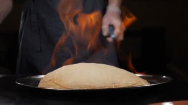 Dorado in flambe salt shell. Dorado fish preparation and serving. Fine cuisine in luxury restaurant. Breaded dorado fish. New recipe of delicious seafood. Full hd