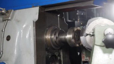 Metal grinding machine with sparks and swarfs in slow motion. Industrial concept grinding metal with sharp sparks. welder grinding smooths steel and iron using modern equipment. Full hd