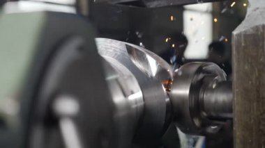Close-up of metal milling machine during grinding out the metal detail in factory. Machinery and professional equipment concept, Metal grinding machine with sparks and swarfs in slow motion. Full hd