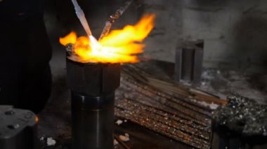 Metallurgy. Welding equipment. Yellow flame melting metal in Slow motion. Factory and Industrial concept, Merge structure of details close-up. Full hd