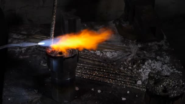 Factory and Industrial concept, Metallurgy. Welding equipment. Yellow flame melting metal in Slow motion. Merge structure of details close-up. Full hd — Wideo stockowe