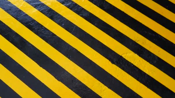Steady shot for background. Yellow-black signal stripes at factory. Safety Floor painting for worker. Allocation of hazardous areas. Safety in factory or plant. Hazardous area marking. Safety — Stock Video
