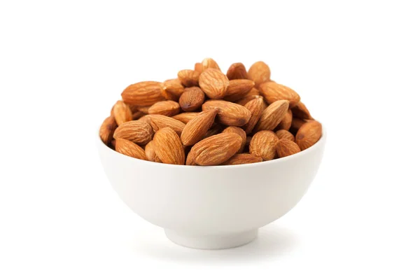 Almonds seed in white ceramic bowl — Stock Photo, Image