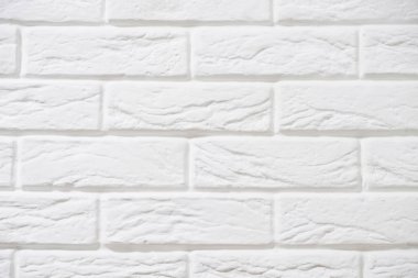 Zayıf bir deseni olan izole edilmiş beyaz tuğla yüzey. Boşluğu kopyala.