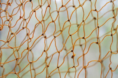 Turuncu halat ağlarının bulanık arkaplanı. Uzayı kopyala Minimalizm.