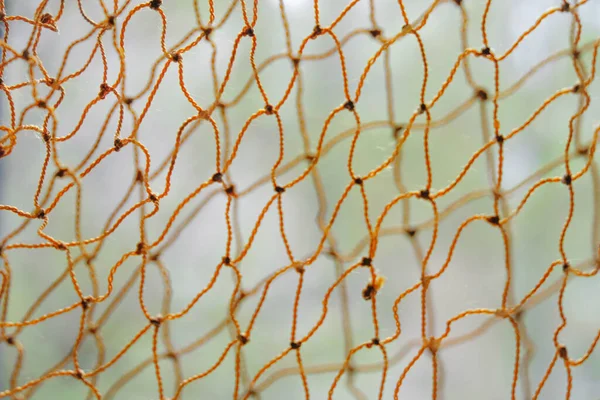 Turuncu halat ağlarının bulanık arkaplanı. Uzayı kopyala Minimalizm.