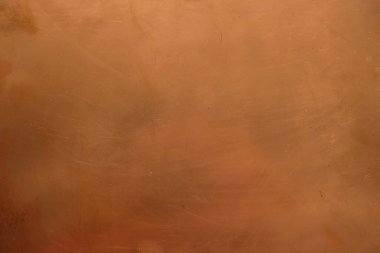 Gün ışığında bakır yüzeyi. Çizikli bakır arka plan. Uzayı kopyala Minimalizm.