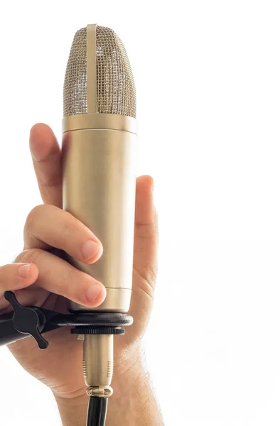 Holding a microphone — Stock Photo, Image