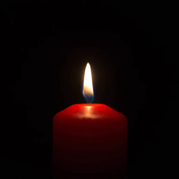 Burning candle on a black background. Stock Image Everypixel
