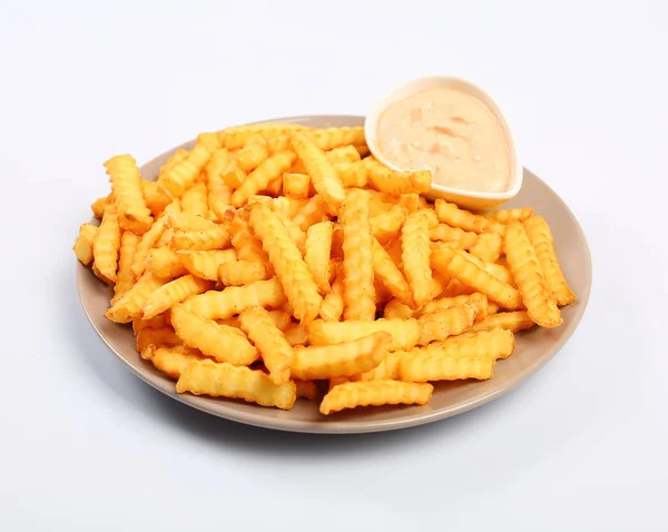 Bir plaka üzerinde Baharatlı hardal soslu patates kızartması.