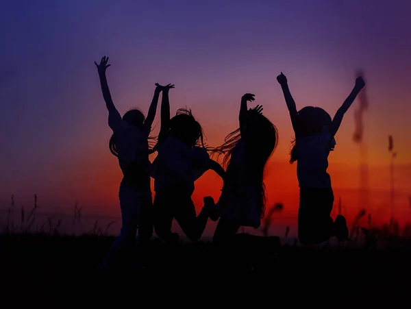 Beautiful Red Sunset Silhouettes Children Girl Having Fun Jumping Blue — Stock Photo, Image