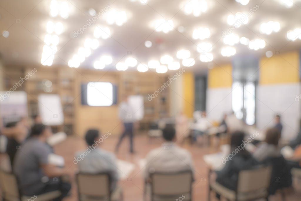 Blurry Asian people sit in round for meeting and share experienc