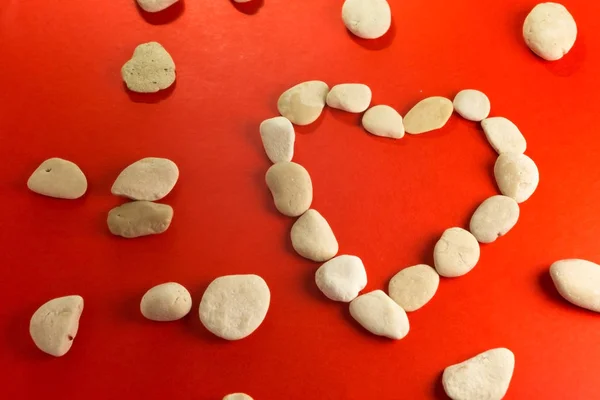 Red heart with white stones — Stockfoto