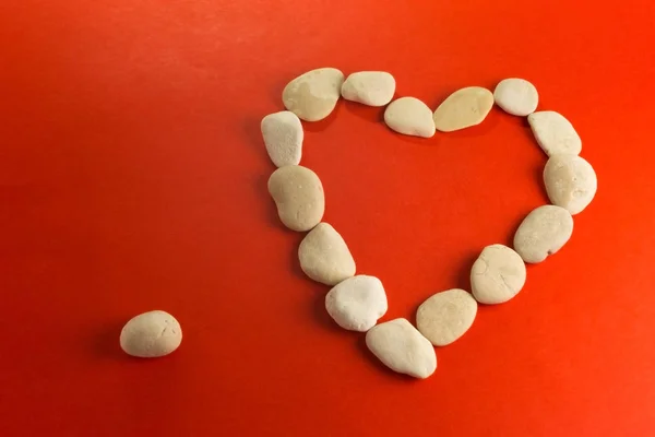 Red heart with white stones — Stock Photo, Image