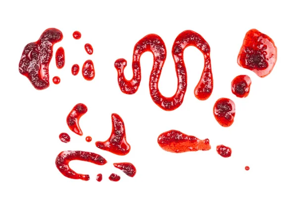 Spruzzi di marmellata rossa isolati su bianco — Foto Stock