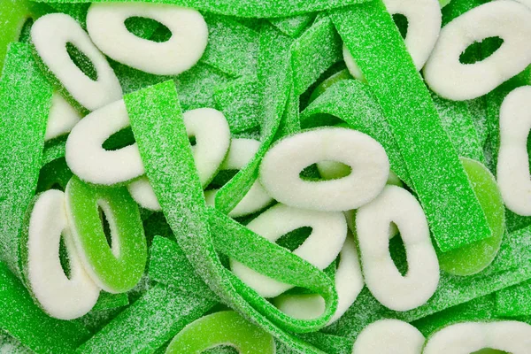 Асорті зелені жувальні цукерки фону. Вид зверху. Цукерки желе — стокове фото
