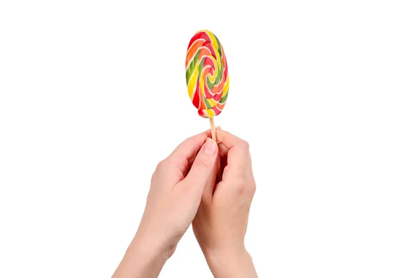 Lollipop v samičí ruce izolované na bílém pozadí. Místo — Stock fotografie