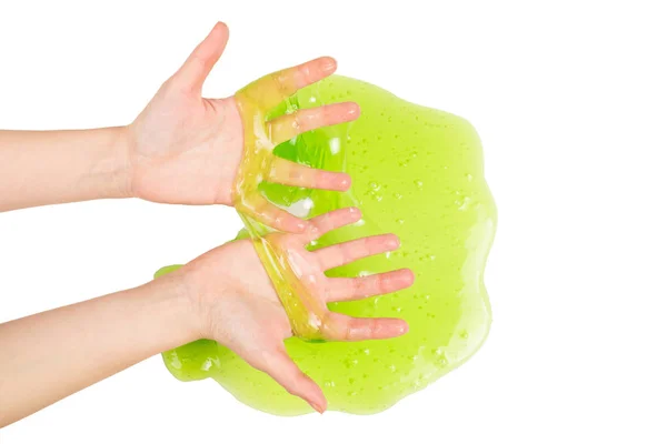 흰 손에 고립된 여자 손의 녹색 점액 장난감. — 스톡 사진