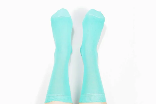 Woman in blue socks isolated on white background. Top view. — Stock Photo, Image