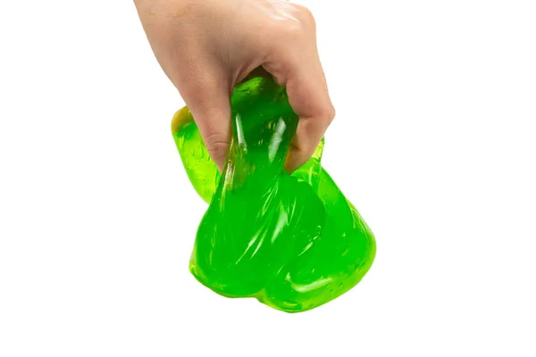 Juguete de limo verde en mano de mujer aislado en blanco. —  Fotos de Stock