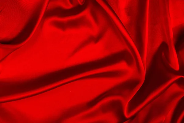Rote Seide oder Satin Luxusstoff Textur kann als abstrakte Rückseite verwendet werden — Stockfoto