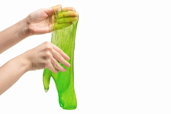 Juguete de limo verde en mano de mujer aislado en blanco. —  Fotos de Stock
