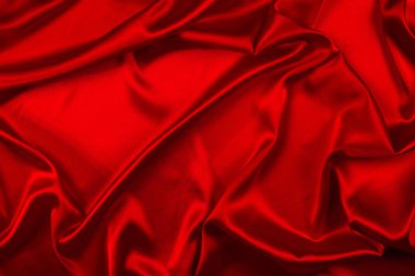 Kırmızı ipek veya sadan lüks kumaş doku soyut geri olarak kullanabilirsiniz