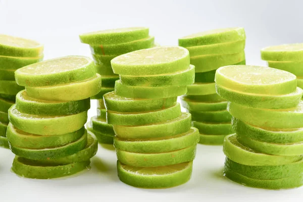 Lime slices isolated on white background. Space for text or desi — Stock Photo, Image