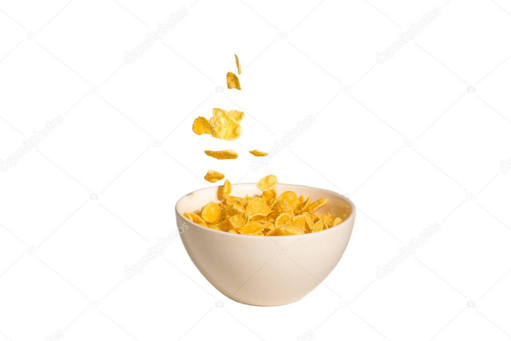 Corn flakes falling to the white bowl. Motion. 