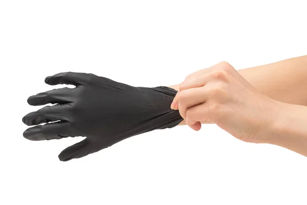 女性は黒いゴム手袋をはめる. — ストック写真