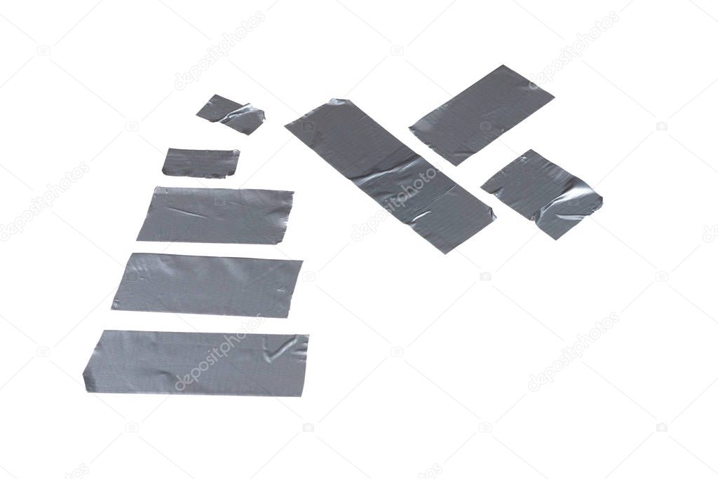 Silver scotch tape pieces isolated on white background. 