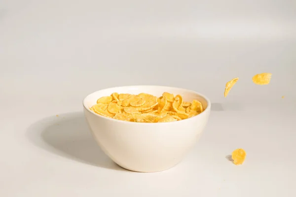 Corn Flakes Falling White Bowl Motion Copyspace Isolated White — Stock Photo, Image