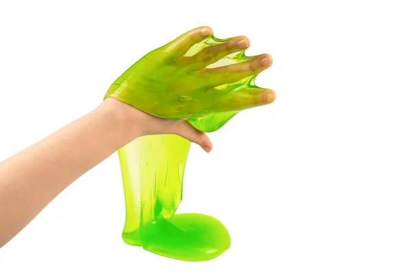 Kadının elindeki yeşil balçık oyuncağı beyaza yapışmış. Üst görünüm.