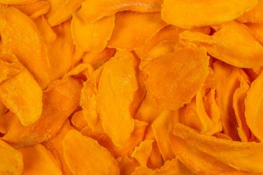 Tatlı mango dilimleri arka planda. Üst görünüm. 