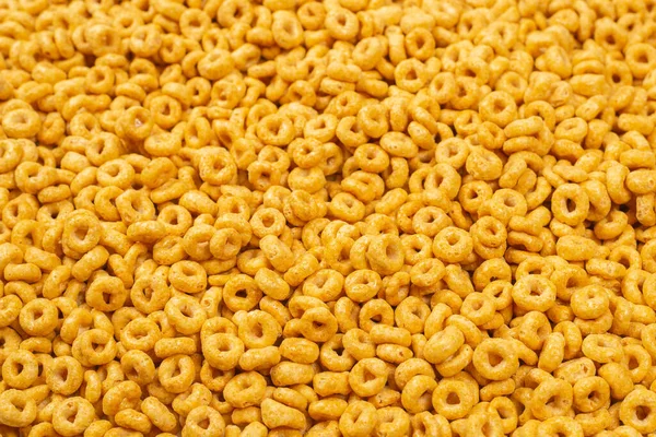Corn-flakes background and texture. Top view. Honey rings cereal box for morning breakfast.