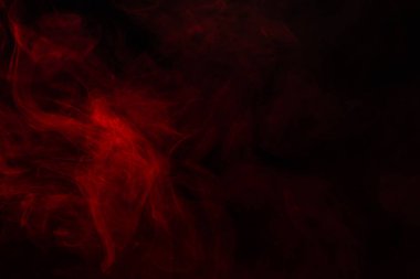 Siyah arka planda kırmızı buhar. Boşluğu kopyala.