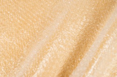 Kabarcık ambalaj bej arka plan. Üst görünüm. 