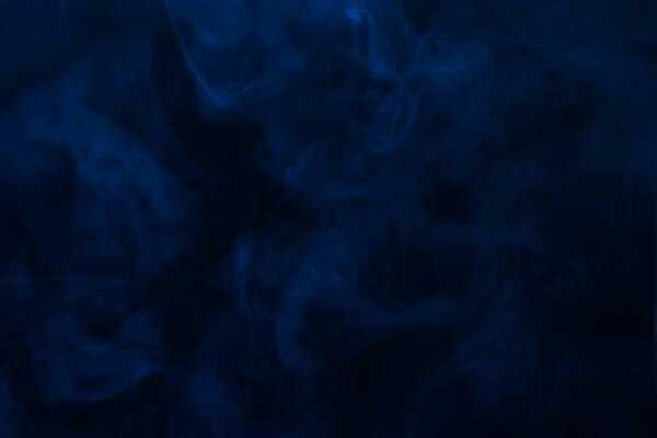 Blue steam on a black background. Copy space.