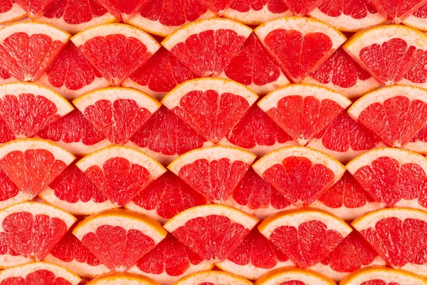Grapefrukt Röda Saftiga Skivor Bakgrund Ovanifrån — Stockfoto