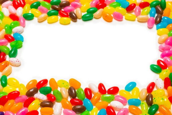 Colorful jelly beans isolated on white. Top view. 