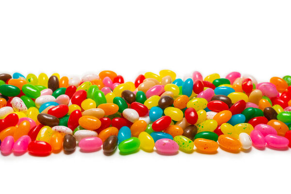 Colorful jelly beans isolated on white. Top view. 