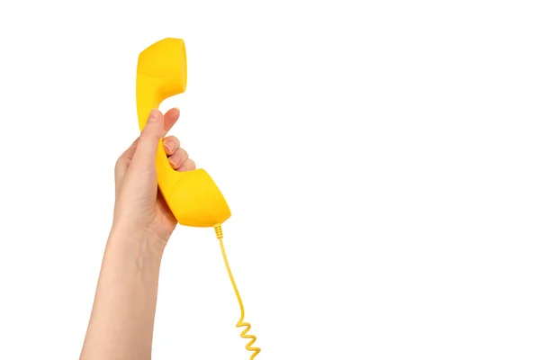 Gele Handset Hand Van Een Vrouw Geïsoleerd Wit Kopieerruimte — Stockfoto