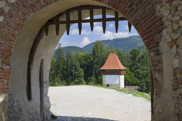 Old gate in a stone fortress wall — Stock Photo, Image