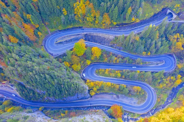 Rocky forest mountain road in autumn