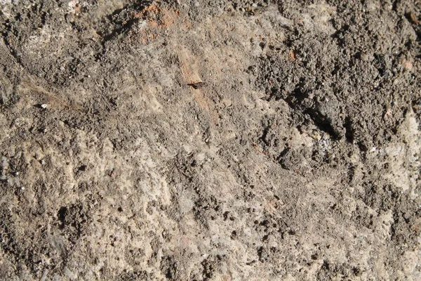 Granit rock närbild bakgrund, sten textur, knäckt yta — Stockfoto