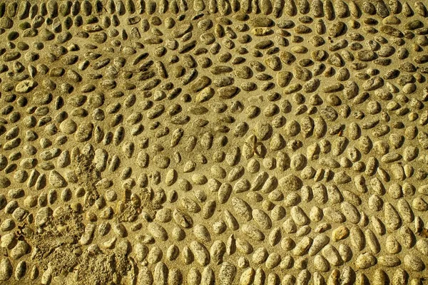 Bonita imagen de fondo de guijarros, textura de rocas redondas — Foto de Stock