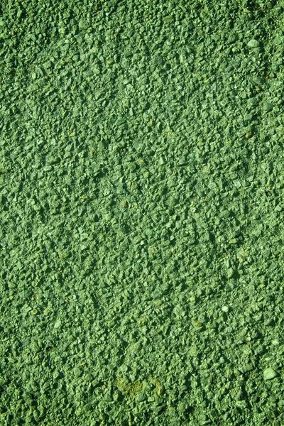 グリーンの花崗岩岩クローズ アップ背景、石のテクスチャ、ひびの入った表面 — ストック写真