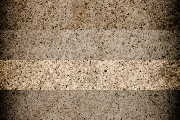 Elegante stenen muur uit kleine vierkante delen. Rots textuur — Stockfoto