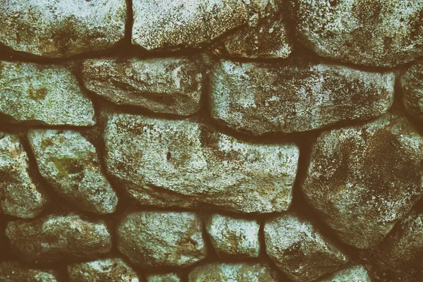 Steinmauer für Hintergrund oder Felsen raue Textur — Stockfoto
